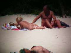 Hot couple caught on a nude beach spy cam vid