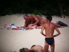 Hot couple caught on a nude beach spy cam vid