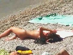 Muscular men and sleek women on a nude beach candid video