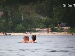 Hot blokes and sexy chicks tanning their bodied on the nudist beach