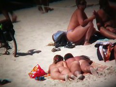 naked and hot on the beach bits of flesh hanging out everywhere