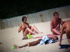 naked and hot on the beach bits of flesh hanging out everywhere