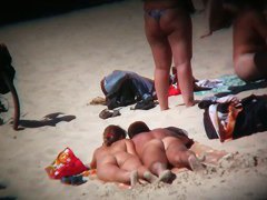 naked and hot on the beach bits of flesh hanging out everywhere