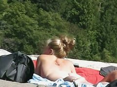 Blonde milfs and teens enjoying the the sun on a nude beach