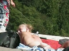 Blonde milfs and teens enjoying the the sun on a nude beach