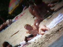 Beach voyeur vid of hippy blonde chick nude sunbathing