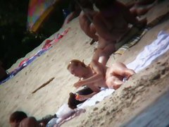 Beach voyeur vid of hippy blonde chick nude sunbathing