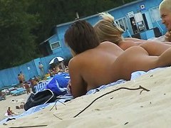 Beach voyeur porn featuring two hot girls and a guy sunbathing naked