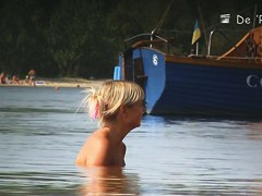 Fat amateur sits on beach voyeur cam with huge naked boobs