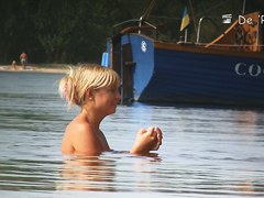 Fat amateur sits on beach voyeur cam with huge naked boobs