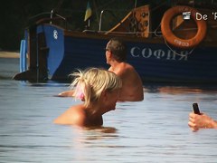 Fat amateur sits on beach voyeur cam with huge naked boobs
