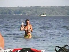 Jiggling tits and round asses on the nude beach candid voyeur videos