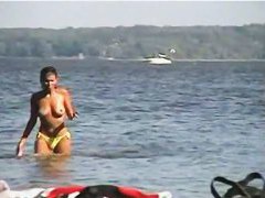 Jiggling tits and round asses on the nude beach candid voyeur videos