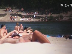 Nudist girl is lying showing the stretched slit to public