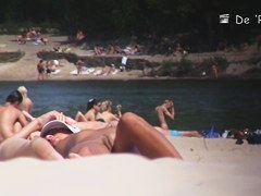 Nudist girl is lying showing the stretched slit to public