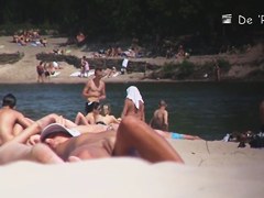 Nudist girl is lying showing the stretched slit to public