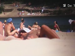 Nudist girl is lying showing the stretched slit to public