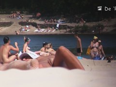 Nudist girl is lying showing the stretched slit to public