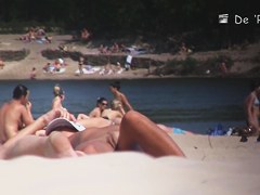 Nudist girl is lying showing the stretched slit to public