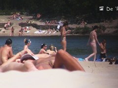 Nudist girl is lying showing the stretched slit to public