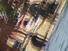 Mature babes with sexy bottoms move naked on the beach