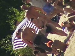 Tiny cutie caught on a nudist beach voyeur cam