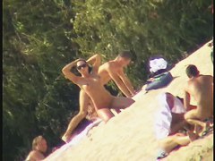 Busty nudist beach MILF caught on a hidden cam