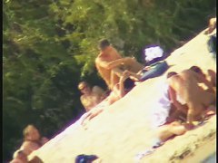 Busty nudist beach MILF caught on a hidden cam