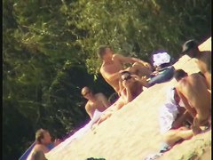Busty nudist beach MILF caught on a hidden cam