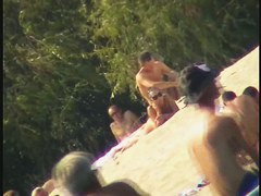 Busty nudist beach MILF caught on a hidden cam