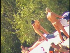 Busty nudist beach MILF caught on a hidden cam