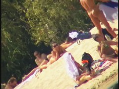 Busty nudist beach MILF caught on a hidden cam