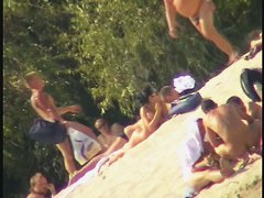 Busty nudist beach MILF caught on a hidden cam