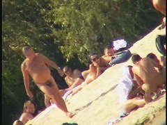 Busty nudist beach MILF caught on a hidden cam