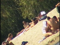 Busty nudist beach MILF caught on a hidden cam