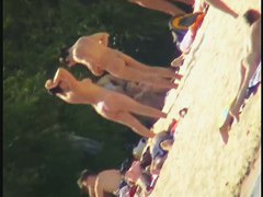 A dirty beach voyeur loves filming with his spy cam.