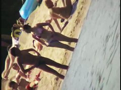 A dirty beach voyeur loves filming with his spy cam.