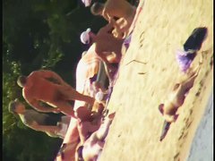 A dirty beach voyeur loves filming with his spy cam.