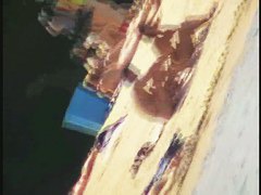 A dirty beach voyeur loves filming with his spy cam.