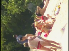 A dirty beach voyeur loves filming with his spy cam.