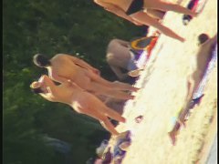 A dirty beach voyeur loves filming with his spy cam.