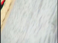 A dirty beach voyeur loves filming with his spy cam.