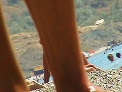 Sexy blond chicks sunbathing on a nude beach