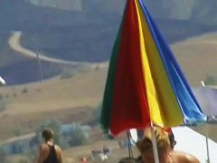 Sexy blond chicks sunbathing on a nude beach