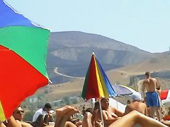 Sexy blond chicks sunbathing on a nude beach