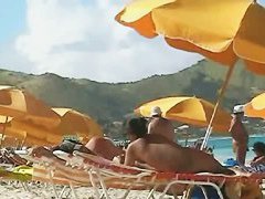 Beach voyeur video of a nude milf and a nude Asian hottie