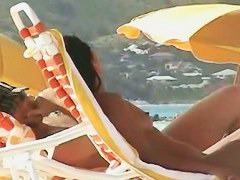 Beach voyeur video of a nude milf and a nude Asian hottie