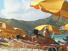Beach voyeur video of a nude milf and a nude Asian hottie
