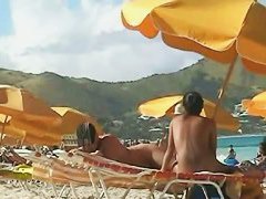 Beach voyeur video of a nude milf and a nude Asian hottie
