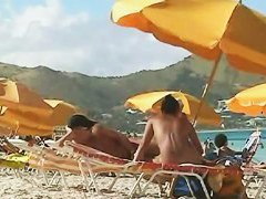 Beach voyeur video of a nude milf and a nude Asian hottie